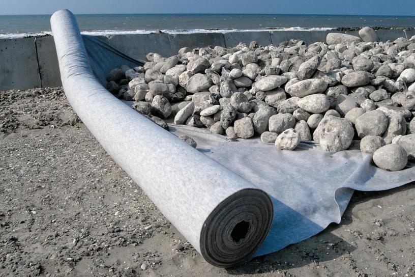 Non-woven geotextile fabric for soft soil layer reinforcement